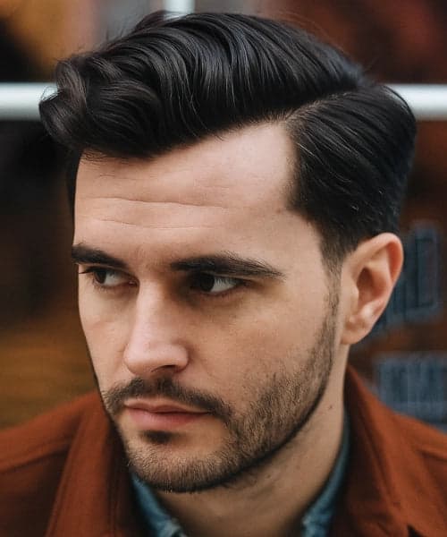 Professional fade with side part haircut at Therapeutic Cuts barbershop Queens NYC